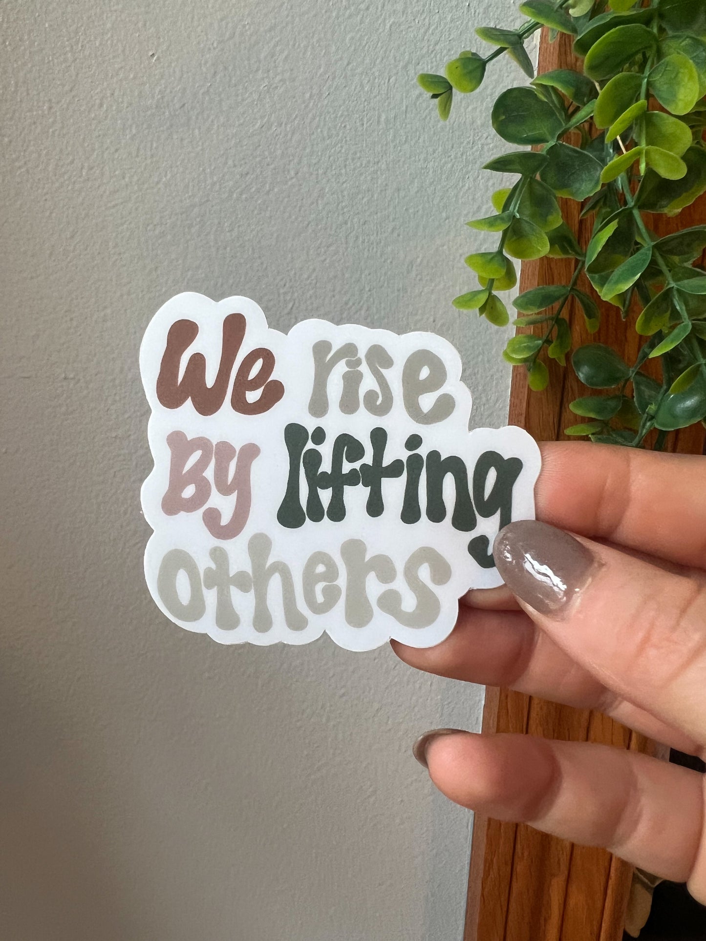 We Rise By Lifting Others Sticker